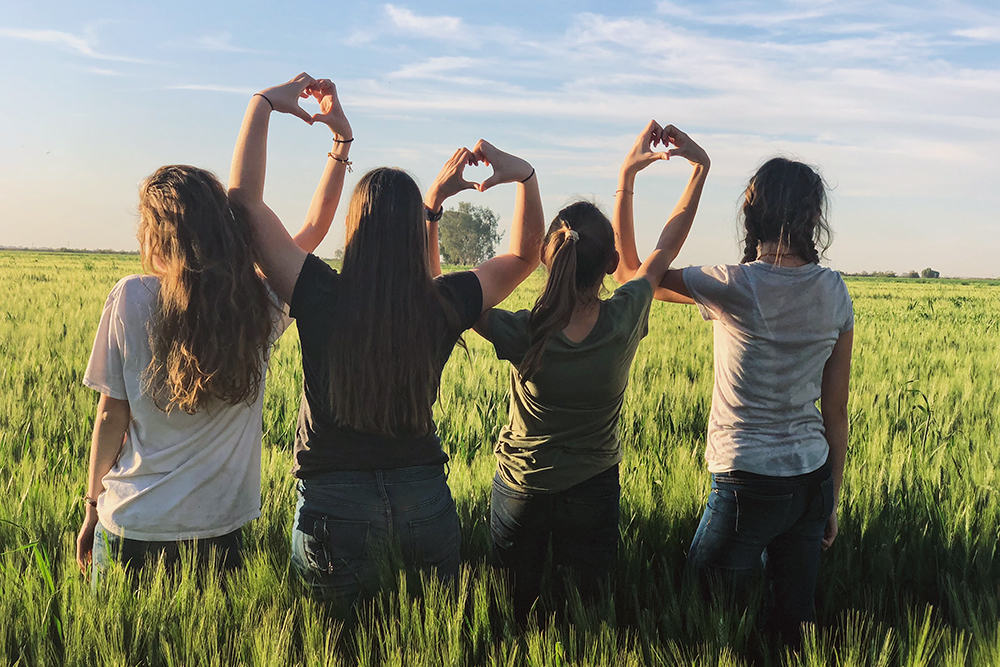 group of young women love symbol